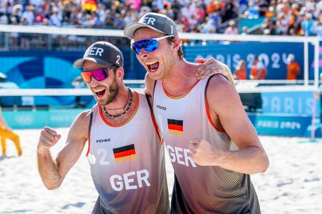 FRA, Summer Olympics Paris 2024, Beach Volleyball , Men , Quarterfinals EHLERS WICKLER GER vs BOERMANS DE GROOT 06 08 2024, Champ de Mars, Paris, FRA, Summer Olympics Paris 2024, Beach Volleyball , Men , Quarterfinals EHLERS WICKLER GER vs BOERMANS DE GROOT, pictured Nils Ehlers GER with Clemens Wickler GER celebrating their victory nordphotoxGmbHx xStraubmeier nph00004