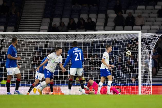 Oleksandr Pikhalyonok of Dynamo Kyiv scores past Rangers goalkeeper Jack Butland during the Champions League qualifying match at Hampden Park, Glasgow. Rangers v Dynamo Kyiv, UEFA Champions League, Third Qualifying Round, Second Leg, Football, Hampden Park, Glasgow, UK, 13 Aug 2024 EDITORIAL USE ONLY No use with unauthorised audio, video, data, fixture lists, club league logos or live services. Online in-match use limited to 120 images, no video emulation. No use in betting, games or single club league player publications. Copyright: xKirkxO Rourke RangersxFC Shutterstockx 14635004dg