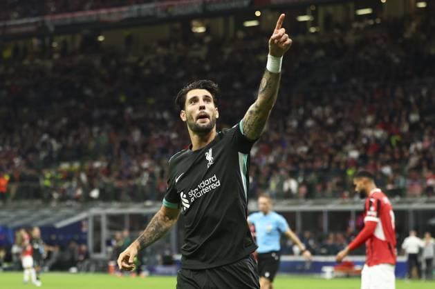 Dominik Szoboszlai of Liverpool celebrates after scoring a goal (1-3) AC Milan v Liverpool, UEFA Champions League, Group Stage, Football, San Siro, Milan, Italy, 17 Sep 2024 EDITORIAL USE ONLY No use with unauthorised audio, video, data, fixture lists, club league logos or live services. Online in-match use limited to 120 images, no video emulation. No use in betting, games or single club league player publications. Copyright: xSimonxDael Shutterstockx 14722111ap