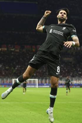 Dominik Szoboszlai of Liverpool celebrates after scoring a goal (1-3) AC Milan v Liverpool, UEFA Champions League, Group Stage, Football, San Siro, Milan, Italy, 17 Sep 2024 EDITORIAL USE ONLY No use with unauthorised audio, video, data, fixture lists, club league logos or live services. Online in-match use limited to 120 images, no video emulation. No use in betting, games or single club league player publications. Copyright: xSimonxDael Shutterstockx 14722111bb
