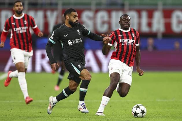 Mohamed Salah of Liverpool chased by Youssouf Fofana of Milan AC Milan v Liverpool, UEFA Champions League, Group Stage, Football, San Siro, Milan, Italy, 17 Sep 2024 EDITORIAL USE ONLY No use with unauthorised audio, video, data, fixture lists, club league logos or live services. Online in-match use limited to 120 images, no video emulation. No use in betting, games or single club league player publications. Copyright: xSimonxDael Shutterstockx 14722111cl