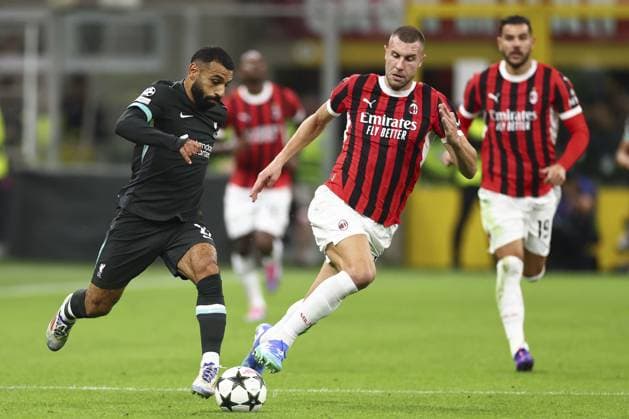 Mohamed Salah of Liverpool chased by Strahinja Pavlovic of Milan AC Milan v Liverpool, UEFA Champions League, Group Stage, Football, San Siro, Milan, Italy, 17 Sep 2024 EDITORIAL USE ONLY No use with unauthorised audio, video, data, fixture lists, club league logos or live services. Online in-match use limited to 120 images, no video emulation. No use in betting, games or single club league player publications. Copyright: xSimonxDael Shutterstockx 14722111ck