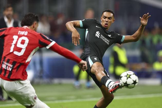 Trent Alexander-Arnold of Liverpool and Theo Hernandez of Milan battle for the ball AC Milan v Liverpool, UEFA Champions League, Group Stage, Football, San Siro, Milan, Italy, 17 Sep 2024 EDITORIAL USE ONLY No use with unauthorised audio, video, data, fixture lists, club league logos or live services. Online in-match use limited to 120 images, no video emulation. No use in betting, games or single club league player publications. Copyright: xSimonxDael Shutterstockx 14722111cc