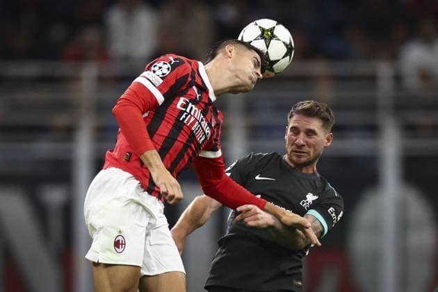 Alvaro Morata of Milan and Alexis Mac Allister of Liverpool battle for the ball AC Milan v Liverpool, UEFA Champions League, Group Stage, Football, San Siro, Milan, Italy, 17 Sep 2024 EDITORIAL USE ONLY No use with unauthorised audio, video, data, fixture lists, club league logos or live services. Online in-match use limited to 120 images, no video emulation. No use in betting, games or single club league player publications. Copyright: xSimonxDael Shutterstockx 14722111di