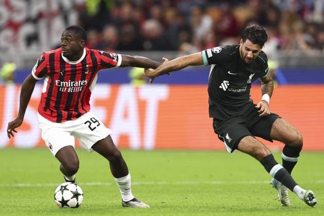 Youssouf Fofana of Milan turns Dominik Szoboszlai of Liverpool AC Milan v Liverpool, UEFA Champions League, Group Stage, Football, San Siro, Milan, Italy, 17 Sep 2024 EDITORIAL USE ONLY No use with unauthorised audio, video, data, fixture lists, club league logos or live services. Online in-match use limited to 120 images, no video emulation. No use in betting, games or single club league player publications. Copyright: xSimonxDael Shutterstockx 14722111cq