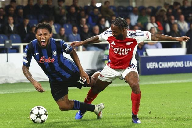 Ederson of Atalanta fouled by Raheem Sterling of Arsenal Atalanta v Arsenal, UEFA Champions League, Group Stage, Football, Gewiss Stadium, Bergamo, Italy, 19 Sep 2024 EDITORIAL USE ONLY No use with unauthorised audio, video, data, fixture lists, club league logos or live services. Online in-match use limited to 120 images, no video emulation. No use in betting, games or single club league player publications. Copyright: xSimonxDael Shutterstockx 14722274au