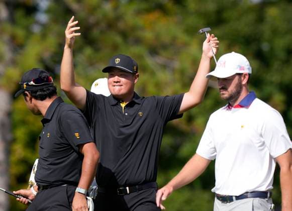September 27, 2024, Montreal, Pq, Canada: International team member Sungjae Im of South Korea, right, celebrates a birdie on the 8th hole with partner Hideki Matsuyama of Japan, as United States team member Patrick Cantlay walks past during the second round foursome match at the Presidents Cup golf tournament at Royal Montreal Golf Club in Montreal, Friday, Sept. 27, 2024. Golf 2024: Presidents Cup: Round Two - ZUMAc35_ 20240927_zaf_c35_039 Copyright: xFrankxGunnx