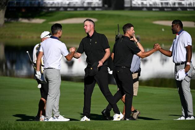 September 27, 2024, Montreal, Pq, Canada: International team member Adam Scott of Australia, left, shakes hands with United States team member Collin Morikawa and International team member Taylor Pendrith of Canada, right, shakes hands with United States team member Sahith Theegala, on the 14th hole during a foursome match at the Presidents Cup golf tournament at the Royal Montreal Golf Club in Montreal, Friday, Sept. 27, 2024. Canada News - September 27, 2024 - ZUMAc35_ 20240927_zaf_c35_141 Copyright: xGrahamxHughesx