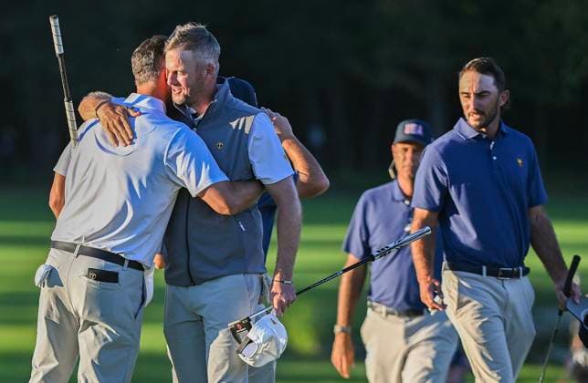 September 28, 2024, Montreal, Pq, Canada: International team members Adam Scott of Australia, left, and Taylor Pendrith of Canada, embrace following their win over the United States in their fourth round foursome match at the Presidents Cup golf tournament at the Royal Montreal Golf Club in Montreal, Saturday, Sept. 28, 2024. Adam Scott, Taylor Pendrith, - ZUMAc35_ 20240928_zaf_c35_173 Copyright: xGrahamxHughesx