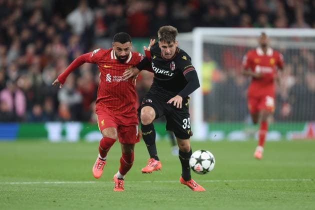 Mohamed Salah of Liverpool and Juan Miranda of Bologna Liverpool v Bologna, UEFA Champions League, Group Stage, Football, Anfield, Liverpool, UK, 02 Oct 2024 EDITORIAL USE ONLY No use with unauthorised audio, video, data, fixture lists, club league logos or live services. Online in-match use limited to 120 images, no video emulation. No use in betting, games or single club league player publications. Copyright: xPhilxOldham Shutterstockx 14750771r