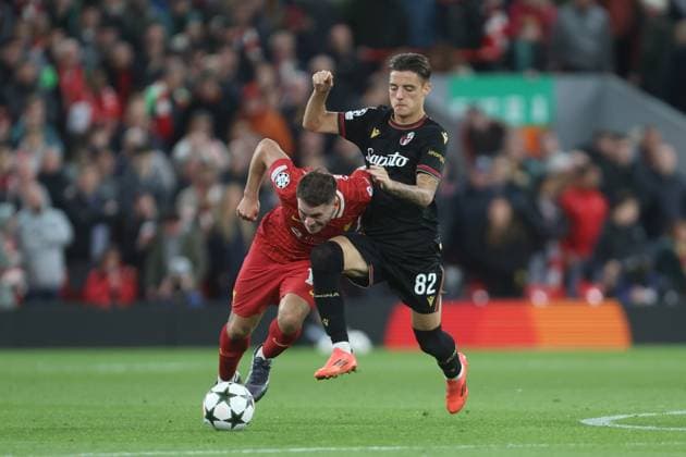 Alexis MacAllister of Liverpol and Kacper Urbanski of Bologna Liverpool v Bologna, UEFA Champions League, Group Stage, Football, Anfield, Liverpool, UK, 02 Oct 2024 EDITORIAL USE ONLY No use with unauthorised audio, video, data, fixture lists, club league logos or live services. Online in-match use limited to 120 images, no video emulation. No use in betting, games or single club league player publications. Copyright: xPhilxOldham Shutterstockx 14750771ac