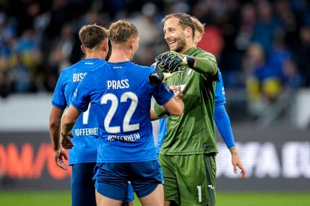 from left Alexander Prass Hoffenheim, 22 , Oliver Baumann goalkeeper, Hoffenheim, 1 , TSG 1899 Hoffenheim player, cheering after the final whistle, joy about the victory, winner, winners, cheers, cheering, cheerful, positive, happy, rejoice, optimistic, highlight, action, action, 03 10 2024, Sinsheim Germany , football, UEFA Europa League, group stage, TSG 1899 Hoffenheim Dynamo Kiev, REGULATIONS PROHIBIT ANY USE OF PHOTOGRAPHS AS IMAGE SEQUENCES AND OR QUASI VIDEO xozx