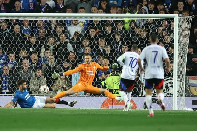 Alexandre Lacazette of Lyon scores his first goal past Rangers goalkeeper Jack Butland during the Europa League group phase match at Ibrox Stadium, Glasgow. Rangers v Lyon, UEFA Europa League, Group Stage, Football, Ibrox Stadium, Glasgow, Portugal, 03 Oct 2024 EDITORIAL USE ONLY No use with unauthorised audio, video, data, fixture lists, club league logos or live services. Online in-match use limited to 120 images, no video emulation. No use in betting, games or single club league player publications. Copyright: xO Rourke RangersxFC Shutterstockx 14755166be