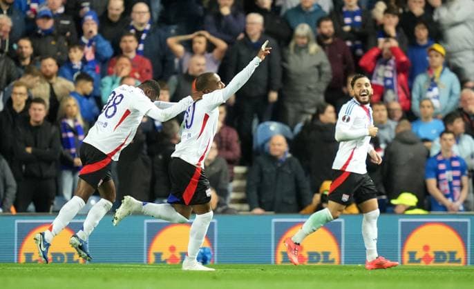 Alexander Lacazette of Olympique Lyonnais is congratulated after scoring his second goal during the UEFA Europa League match between Rangers FC and Olympique Lyonnais at Ibrox Stadium, Glasgow on 3rd October, 2024. Rangers v Lyon, UEFA Europa League, Group Stage, Football, Ibrox Stadium, Glasgow, Scotland, UK, 03 Oct 2024 EDITORIAL USE ONLY No use with unauthorised audio, video, data, fixture lists, club league logos or live services. Online in-match use limited to 120 images, no video emulation. No use in betting, games or single club league player publications. Copyright: xMarkxRunnacles Shutterstockx 14750818bc