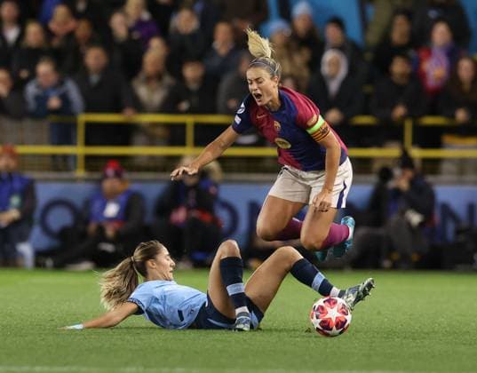 Alexia Putellas of Barcelona is fouled by Laia Aleixandri of Manchester City Manchester City Women v Barcelona Women, UEFA Women s Champions League, Group D, Second Leg, Football, Joie Stadium , Manchester, UK, 09 Oct 2024 EDITORIAL USE ONLY No use with unauthorised audio, video, data, fixture lists, club league logos or live services. Online in-match use limited to 120 images, no video emulation. No use in betting, games or single club league player publications. Copyright: xPaulxCurrie Shutterstockx 14767396x