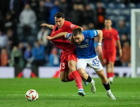 Nicolas Raskin of Rangers challenges for the ball with Risto Radunovic of FCSB. Rangers v FCSB, UEFA Europa League, Group Stage, Football, Ibrox Stadium, Glasgow, Scotland, UK, 24 Oct 2024 EDITORIAL USE ONLY No use with unauthorised audio, video, data, fixture lists, club league logos or live services. Online in-match use limited to 120 images, no video emulation. No use in betting, games or single club league player publications. Copyright: xStuartxWallace Shutterstockx 14801669dr