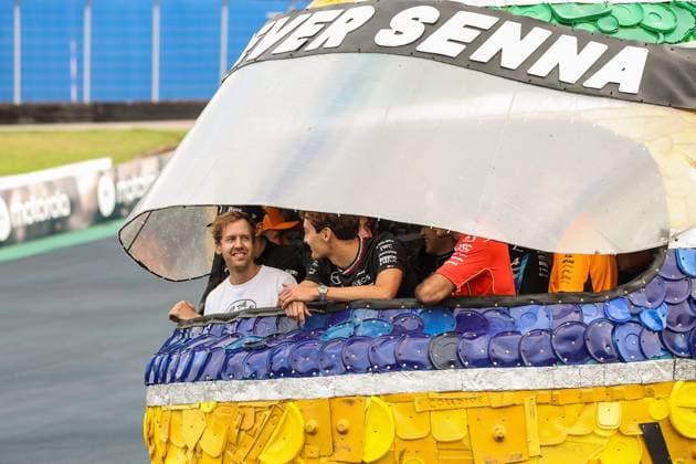 RUSSELL George (gbr), Mercedes AMG F1 Team W15, portrait SAINZ Carlos (spa), Scuderia Ferrari SF-24, portrait at Senna Tribute with gigant replica Senna helmet, casque, created by local artists working with Sebastian Vettel and Senna Foundation during the Formula 1 Grande Premio de Sao Paulo 2024, 21th round of the 2024 Formula One World Championship, WM, Weltmeisterschaft from November 1 to 3, 2024 on the Interlagos Circuit, in Sao Paulo, Brazil - F1 - SAO PAULO GRAND PRIX 2024 DPPI Panoramic 241031_R21_BRASILE_DP_XB3_0125_1