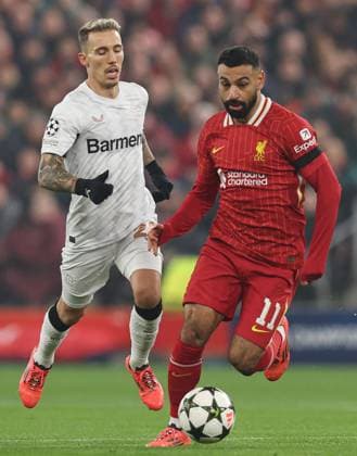 Mohamed Salah of Liverpool under pressure from Ãlex Grimaldo of Bayer 04 Leverkusen Liverpool v Bayer 04 Leverkusen, UEFA Champions League, Group Stage, Football, Anfield, Liverpool, UK - 05 Nov 2024 EDITORIAL USE ONLY No use with unauthorised audio, video, data, fixture lists, club league logos or live services. Online in-match use limited to 120 images, no video emulation. No use in betting, games or single club league player publications. Copyright: xPaulxCurrie Shutterstockx 14863785ae