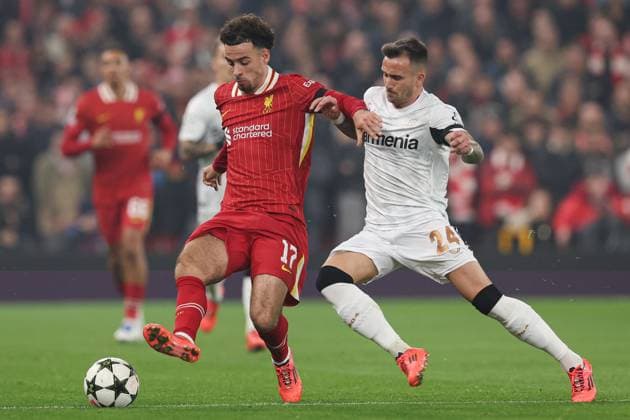 Curtis Jones of Liverpool (L) battles with Aleix Garcia of Bayer 04 Leverkusen (R) Liverpool v Bayer 04 Leverkusen, UEFA Champions League, Group Stage, Football, Anfield, Liverpool, UK - 05 Nov 2024 EDITORIAL USE ONLY No use with unauthorised audio, video, data, fixture lists, club league logos or live services. Online in-match use limited to 120 images, no video emulation. No use in betting, games or single club league player publications. Copyright: xPaulxCurrie Shutterstockx 14863785au