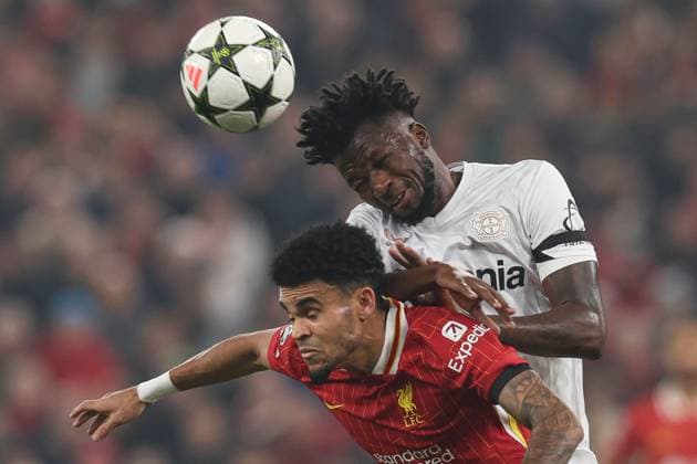 Edmond Tapsoba of Bayer 04 Leverkusen heads the ball under pressure from Luis Diaz of Liverpool Liverpool v Bayer 04 Leverkusen, UEFA Champions League, Group Stage, Football, Anfield, Liverpool, UK - 05 Nov 2024 EDITORIAL USE ONLY No use with unauthorised audio, video, data, fixture lists, club league logos or live services. Online in-match use limited to 120 images, no video emulation. No use in betting, games or single club league player publications. Copyright: xPaulxCurrie Shutterstockx 14863785bh