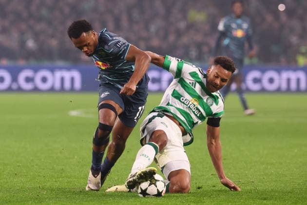 Celtic Glasgow RB Leipzig Champions League Glasgow, 05 11 2024, Celtic Park, Football, UEFA Champions League, Matchday 4 , Celtic Glasgow vs RB Leipzig , Pictured v l Lois Openda 11, RB Leipzig and Auston Trusty 6, Celtic , Only editorial use Photo intended for editorial use only , UEFA regulations prohibit any use of photographs as image sequences and or quasi video ,