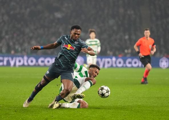 Loïs Openda of RB Leipzig challenges for the ball with Auston Trusty of Celtic. Celtic v RB Leipzig, UEFA Champions League, Group Stage, Football, Celtic Park, Glasgow, Scotland, UK - 05 Nov 2024 EDITORIAL USE ONLY No use with unauthorised audio, video, data, fixture lists, club league logos or live services. Online in-match use limited to 120 images, no video emulation. No use in betting, games or single club league player publications. Copyright: xStuartxWallace Shutterstockx 14863772de