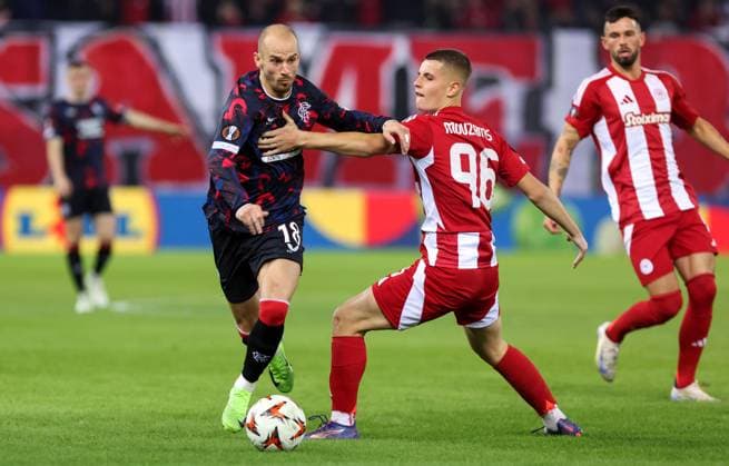 Vaclav Cerny of Rangers and Christos Mouzakitis of Olympiakos Olympiakos v Rangers, UEFA Europa League, Group Stage, Football, Georgios Karaiskakis Stadium, Pireas, Greece - 07 Nov 2024 EDITORIAL USE ONLY No use with unauthorised audio, video, data, fixture lists, club league logos or live services. Online in-match use limited to 120 images, no video emulation. No use in betting, games or single club league player publications. Copyright: xCostasxBaltas Shutterstockx 14878028ad