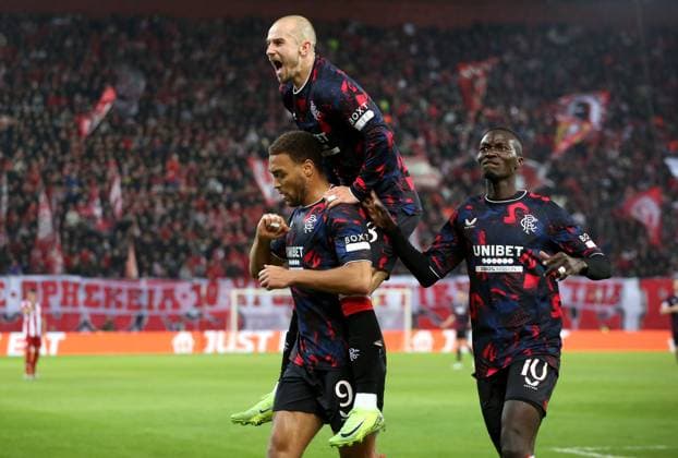 Cyriel Dessers of Rangers celebrates scoring the equalising goal with Mohammed Diomande and Vaclav Cerny Olympiakos v Rangers, UEFA Europa League, Group Stage, Football, Georgios Karaiskakis Stadium, Pireas, Greece - 07 Nov 2024 EDITORIAL USE ONLY No use with unauthorised audio, video, data, fixture lists, club league logos or live services. Online in-match use limited to 120 images, no video emulation. No use in betting, games or single club league player publications. Copyright: xCostasxBaltas Shutterstockx 14878028aq