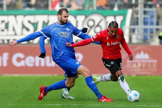 Aleksandar Vukotic SV Darmstadt 98 and Monju Momuluh Hannover 96 battle for the ball, 2 Bundesliga, Hannover 96 vs SV Darmstadt 98, Heinz von Heiden Arena, November 23, 2024 in Hanover, Germany Photo by Marco Steinbrenner DeFodi Images Aleksandar Vukotic SV Darmstadt 98 and Monju Momuluh Hannover 96 battle for the ball, 2 Bundesliga, Hannover 96 vs SV Darmstadt 98, Heinz von Heiden Arena, November 23, 2024 in Hanover, Germany Photo by Marco Steinbrenner DeFodi Images DFB DFL REGULATIONS PROHIBIT ANY USE OF PHOTOGRAPHS AS IMAGE SEQUENCES AND OR QUASI VIDEO Defodi 700 hannover darmstadt 20241123 031 Defodi-700 DFB DFL REGULATIONS PROHIBIT ANY USE OF PHOTOGRAPHS AS IMAGE SEQUENCES AND OR QUASI-VIDEO.