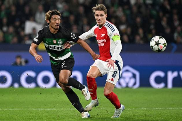 Martin odegaard of Arsenal (R) battles with Hidemasa Morita of Sporting CP (L) Sporting Lisbon v Arsenal, UEFA Champions League, Group Stage, Football, Estadio Jose Alvalade, Lisbon, Portugal - 26 Nov 2024 EDITORIAL USE ONLY No use with unauthorised audio, video, data, fixture lists, club league logos or live services. Online in-match use limited to 120 images, no video emulation. No use in betting, games or single club league player publications. Copyright: xZedxJameson Shutterstockx 14940177ap