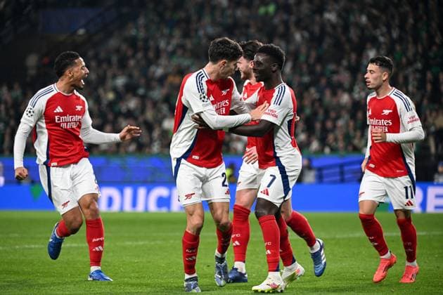 Kai Havertz of Arsenal celebrates scoring the goal for their side with their teammates to make it 2-0 Sporting Lisbon v Arsenal, UEFA Champions League, Group Stage, Football, Estadio Jose Alvalade, Lisbon, Portugal - 26 Nov 2024 EDITORIAL USE ONLY No use with unauthorised audio, video, data, fixture lists, club league logos or live services. Online in-match use limited to 120 images, no video emulation. No use in betting, games or single club league player publications. Copyright: xZedxJameson Shutterstockx 14940177aq