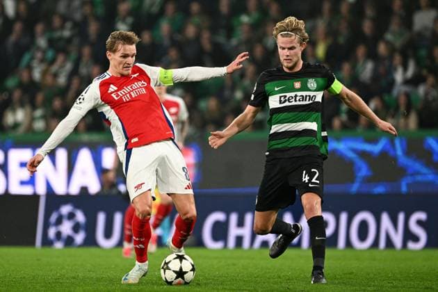 Martin odegaard of Arsenal under pressure from Morten Hjulmand of Sporting CP Sporting Lisbon v Arsenal, UEFA Champions League, Group Stage, Football, Estadio Jose Alvalade, Lisbon, Portugal - 26 Nov 2024 EDITORIAL USE ONLY No use with unauthorised audio, video, data, fixture lists, club league logos or live services. Online in-match use limited to 120 images, no video emulation. No use in betting, games or single club league player publications. Copyright: xZedxJameson Shutterstockx 14940177br