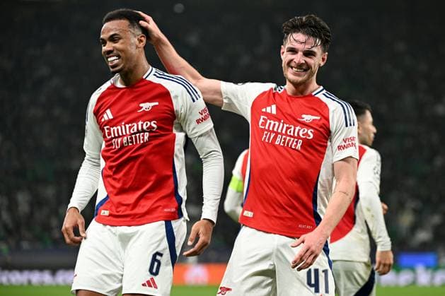 Gabriel Magalhaes of Arsenal (L) celebrates scoring a goal for their side to make it 3-0 with Declan Rice of Arsenal (R) Sporting Lisbon v Arsenal, UEFA Champions League, Group Stage, Football, Estadio Jose Alvalade, Lisbon, Portugal - 26 Nov 2024 EDITORIAL USE ONLY No use with unauthorised audio, video, data, fixture lists, club league logos or live services. Online in-match use limited to 120 images, no video emulation. No use in betting, games or single club league player publications. Copyright: xZedxJameson Shutterstockx 14940177cu