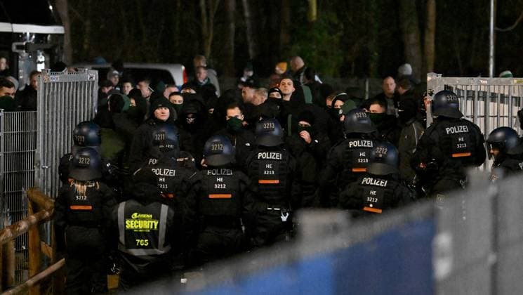 30 11 2024, xfux, Fußball 2 Bundesliga, SV Darmstadt 98 Preussen Münster, emspor, v l Fans or Ultras of Preußen Münster storm from the parking lot for guest fans towards the forest after the game The police are able to push some of the fans back into the parking lot Afterwards there is a confrontation with the police, which can finally push the fans back to the parking lot Obviously because there are not enough police forces and because of the cold, the fans are allowed to drive home without being checked despite the riots Fans, fan, fan block, Mood, scarf, scarves, flag, flags, emotion of SC Preußen Münster Preussen Muenster Violence, riot, riots, rioting, police, fan, fans, Ultras, hooligans, BFE, dog squad, masking, riot, fan riots, riots, rioting, brawl, Security, Sicherheitsdienst DFL DFB REGULATIONS PROHIBIT ANY USE OF PHOTOGRAPHS as IMAGE SEQUENCES and or QUASI VIDEO Licensing of the photographic work to and or by SV Darmstadt 1898 e V and subsidiaries is not permitted No release of or sale to SV Darmstadt 1898 e V Darmstadt