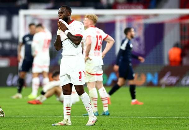 Lutsharel Geertruida of RB Leipzig looks dejected. RB Leipzig v Aston Villa, UEFA Champions League, Group Stage, Football, Red Bull Arena, Leipzig, Germany - 10 Dec 2024 EDITORIAL USE ONLY No use with unauthorised audio, video, data, fixture lists, club league logos or live services. Online in-match use limited to 120 images, no video emulation. No use in betting, games or single club league player publications. Copyright: xJamesxMarsh Shutterstockx 14984467bw
