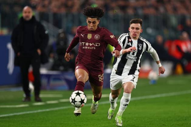 Rico Lewis of Manchester City chased by Francisco Conceicao of Juventus Juventus v Manchester City, UEFA Champions League, Group Stage, Football, Allianz Stadium, Turin, Italy - 11 Dec 2024 EDITORIAL USE ONLY No use with unauthorised audio, video, data, fixture lists, club league logos or live services. Online in-match use limited to 120 images, no video emulation. No use in betting, games or single club league player publications. Copyright: xSimonxDael Shutterstockx 14984981j