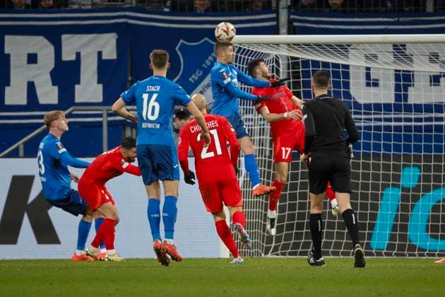 Andrej Kramaric TSG Hoffenheim, 27 and Mihai Popescu FCSB Bucharest, 17 in a header duel , Soccer, UEFA Europa League, Matchday 6, 2024 2025, TSG Hoffenheim vs FCSB Bucharest, 12 12 2024, Rhein Neckar Arena, Sinsheim, Germany Sinsheim Rhein Neckar Arena Baden Württemberg Germany Copyright: xGrantxHubbsx