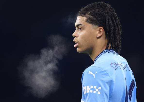 Jahmai Simpson-Pusey of Manchester City blows warm vapour from their mouth Manchester City v Salford City, Emirates FA Cup, Third Round, Football, Etihad Stadium, Manchester, UK - 11 Jan 2025 EDITORIAL USE ONLY No use with unauthorised audio, video, data, fixture lists, club league logos or live services. Online in-match use limited to 120 images, no video emulation. No use in betting, games or single club league player publications. Copyright: xMattxWest Shutterstockx 15094576t