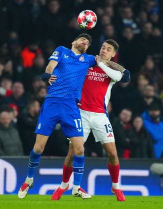 Sandro Kulenovic of Dinamo Zagreb grapples with Jakub Kiwior of Arsenal Arsenal v Dinamo Zagreb, UEFA Champions League, Group Stage, Football, Emirates Stadium, London, UK - 22 Jan 2025 EDITORIAL USE ONLY No use with unauthorised audio, video, data, fixture lists, club league logos or live services. Online in-match use limited to 120 images, no video emulation. No use in betting, games or single club league player publications. Copyright: xJavierxGarcia Shutterstockx 15108893cg
