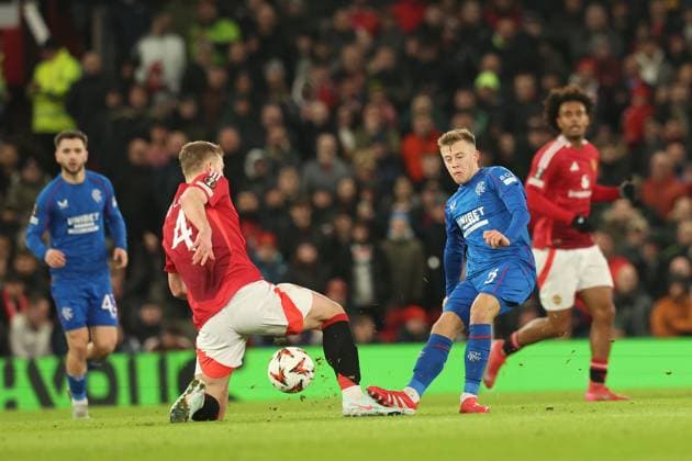 Matthijs de Ligt of Manchester United, ManU and Connor Barron both go for the ball during the Europa League group phase match at Old Trafford, Manchester. Manchester United v Rangers, UEFA Europa League, Group Stage, Football, Old Trafford, Manchester, UK - 23 Jan 2025 EDITORIAL USE ONLY No use with unauthorised audio, video, data, fixture lists, club league logos or live services. Online in-match use limited to 120 images, no video emulation. No use in betting, games or single club league player publications. Copyright: xRangersxFC Shutterstockx 15111693fx