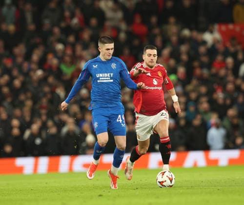 Bailey Rice of Rangers and Diogo Dalot of Manchester United, ManU during the Europa League group phase match at Old Trafford, Manchester. Manchester United v Rangers, UEFA Europa League, Group Stage, Football, Old Trafford, Manchester, UK - 23 Jan 2025 EDITORIAL USE ONLY No use with unauthorised audio, video, data, fixture lists, club league logos or live services. Online in-match use limited to 120 images, no video emulation. No use in betting, games or single club league player publications. Copyright: xRangersxFC Shutterstockx 15111693gv