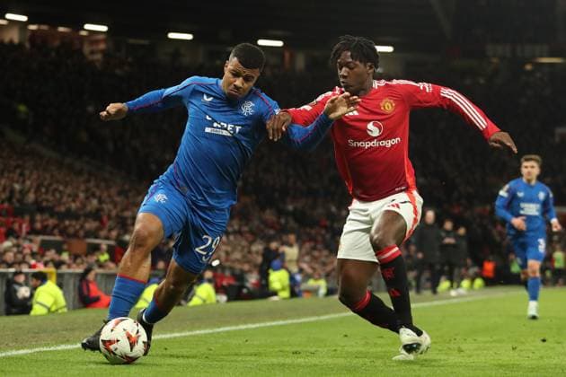 Hamza Igamane of Rangers battles for the ball with Kobbie Mainoo of Manchester United, ManU during the Europa League group phase match at Old Trafford, Manchester. Manchester United v Rangers, UEFA Europa League, Group Stage, Football, Old Trafford, Manchester, UK - 23 Jan 2025 EDITORIAL USE ONLY No use with unauthorised audio, video, data, fixture lists, club league logos or live services. Online in-match use limited to 120 images, no video emulation. No use in betting, games or single club league player publications. Copyright: xRangersxFC Shutterstockx 15111693ix