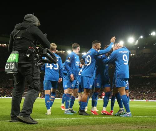 Cyriel Dessers of Rangers celebrates his goal with his team mates during the Europa League group phase match at Old Trafford, Manchester. Manchester United, ManU v Rangers, UEFA Europa League, Group Stage, Football, Old Trafford, Manchester, UK - 23 Jan 2025 EDITORIAL USE ONLY No use with unauthorised audio, video, data, fixture lists, club league logos or live services. Online in-match use limited to 120 images, no video emulation. No use in betting, games or single club league player publications. Copyright: xRangersxFC Shutterstockx 15111693mw