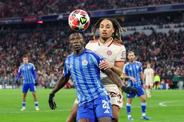 Sharani Zuberu SK Slovan Bratislava and Sacha Boey FC Bayern Muenchen battle for the ball, UEFA Champions League 2024 25 League Phase MD8, FC Bayern Munich v SK Slovan Bratislava, Allianz Arena on January 29, 2025 in Munich, Germany Photo by Marco Steinbrenner DeFodi Images Sharani Zuberu SK Slovan Bratislava and Sacha Boey FC Bayern Muenchen battle for the ball, UEFA Champions League 2024 25 League Phase MD8, FC Bayern München v SK Slovan Bratislava, Allianz Arena, January 29, 2025 in Munich, Germany Photo by Marco Steinbrenner DeFodi Images Defodi 700 muenchen bratis 20250129 027 Defodi-700