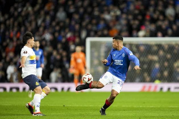Hamza Igamane of Rangers flicks the ball over Kevin Mac Allister of Union Saint-Gilloise Rangers v Union Saint-Gilloise, UEFA Europa League, Group Stage, Football, Ibrox Stadium, Glasgow, UK - 30 Jan 2025 EDITORIAL USE ONLY No use with unauthorised audio, video, data, fixture lists, club league logos or live services. Online in-match use limited to 120 images, no video emulation. No use in betting, games or single club league player publications. Copyright: xStuartxWallace Shutterstockx 15122181bc