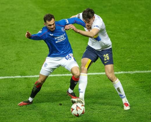 Nedim Bajrami of Rangers in action with Ross Sykes of Union Saint-Gilloise during the UEFA Europa League league phase match at Ibrox Stadium, Glasgow. Rangers v Union Saint-Gilloise, Europa League, Football, Ibrox Stadium, Glasgow, Scotland, UK - 30 Jan 2025 EDITORIAL USE ONLY No use with unauthorised audio, video, data, fixture lists, club league logos or live services. Online in-match use limited to 120 images, no video emulation. No use in betting, games or single club league player publications. Copyright: xRangersxFC Shutterstockx 15126400v
