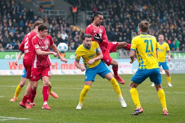 Ermin Bicakcic M ,Eintracht Braunschweig,6 vs Damion Downs r ,1 FC Köln,42 and Eric Martel 1 FC Köln,6 2 Soccer Bundesliga Season 2024 2025 Eintracht Braunschweig vs 1 FC Köln at Eintracht Stadion in Braunschweig Action,Soccer,Man,Men,Germany,01 02 2025