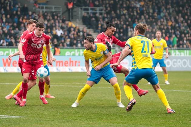 Ermin Bicakcic M ,Eintracht Braunschweig,6 vs Damion Downs r ,1 FC Köln,42 and Eric Martel 1 FC Köln,6 2 Soccer Bundesliga Season 2024 2025 Eintracht Braunschweig vs 1 FC Köln at Eintracht Stadion in Braunschweig Action,Soccer,Man,Men,Germany,01 02 2025
