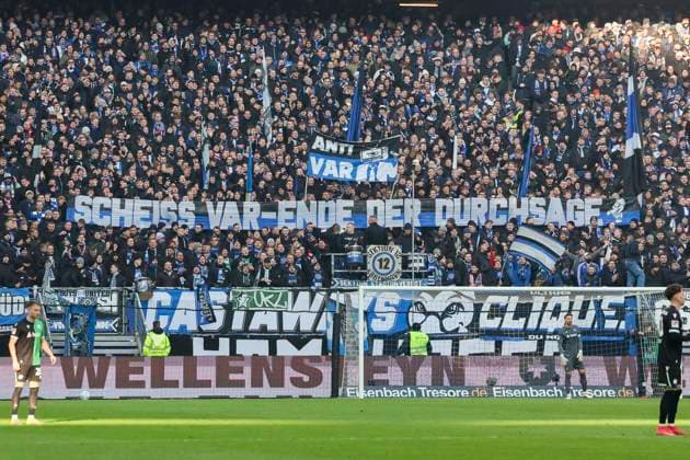 The fans of Hamburger SV protest with posters against the announcement of decisions by the referee and VAR, 2 Bundesliga, Hamburger SV vs Hannover 96, Volksparkstadion, February 2, 2025 in Hamburg, Germany Photo by Marco Steinbrenner DeFodi Images The fans of Hamburger SV protest with posters against the announcement of decisions by the referee and VAR, 2 Bundesliga, Hamburger SV vs Hannover 96, Volksparkstadion, February 2, 2025 in Hamburg, Germany Photo by Marco Steinbrenner DeFodi Images DFB DFL REGULATIONS PROHIBIT ANY USE OF PHOTOGRAPHS AS IMAGE SEQUENCES AND OR QUASI VIDEO Defodi 700 hsv hannover 20250102 065 Defodi-700 DFB DFL REGULATIONS PROHIBIT ANY USE OF PHOTOGRAPHS AS IMAGE SEQUENCES AND OR QUASI-VIDEO.