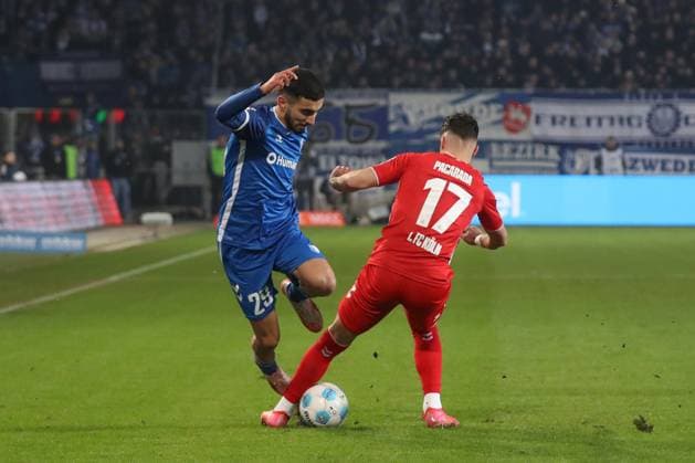 14 02 2025, xgox, Fußball 2 Bundesliga, 1 FC Magdeburg 1 FC Koeln emspor, v l Livian Burcu Magdeburg, 29 , Dejan Ljubicic Koeln, 7 Zweikampf, Duell, Kampf, tackle DFL DFB REGULATIONS PROHIBIT ANY USE OF PHOTOGRAPHS as IMAGE SEQUENCES and or QUASI VIDEO Magdeburg